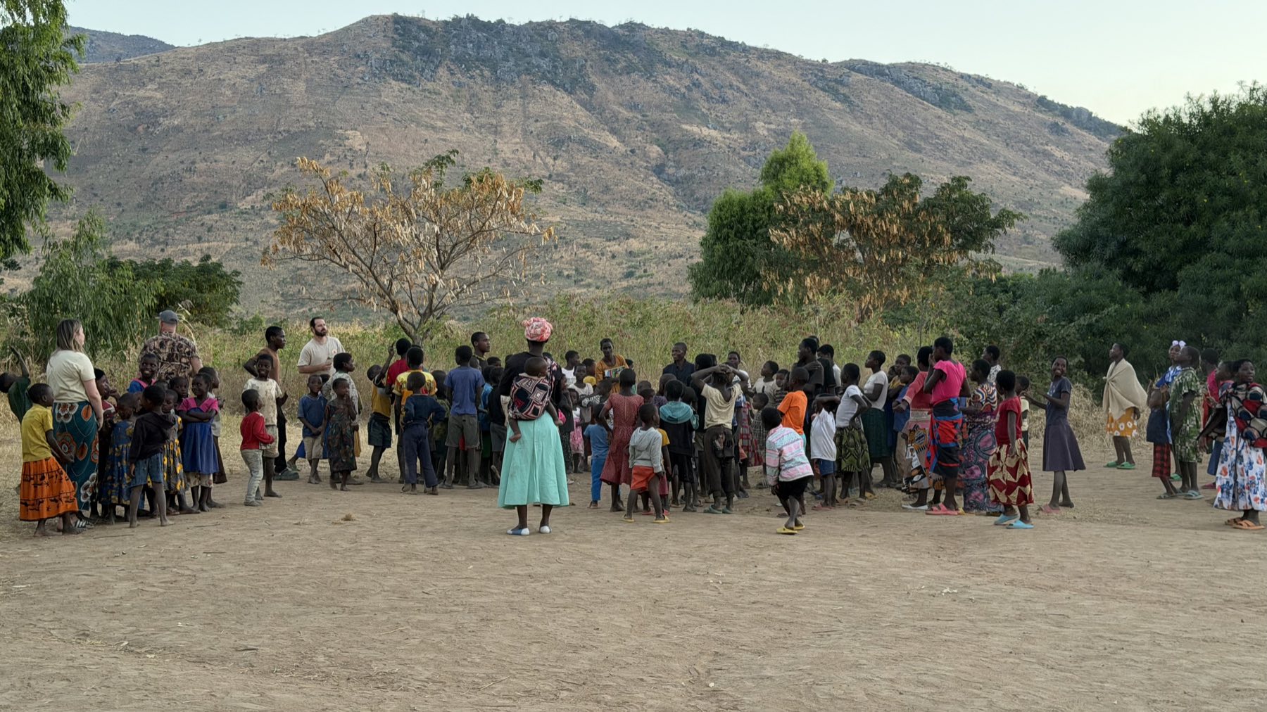 Children and families gathered in a Malawian village
