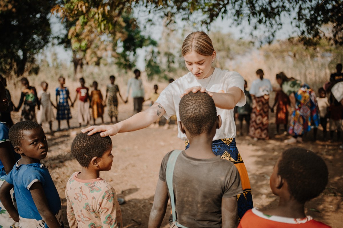Hands laid on children in prayer